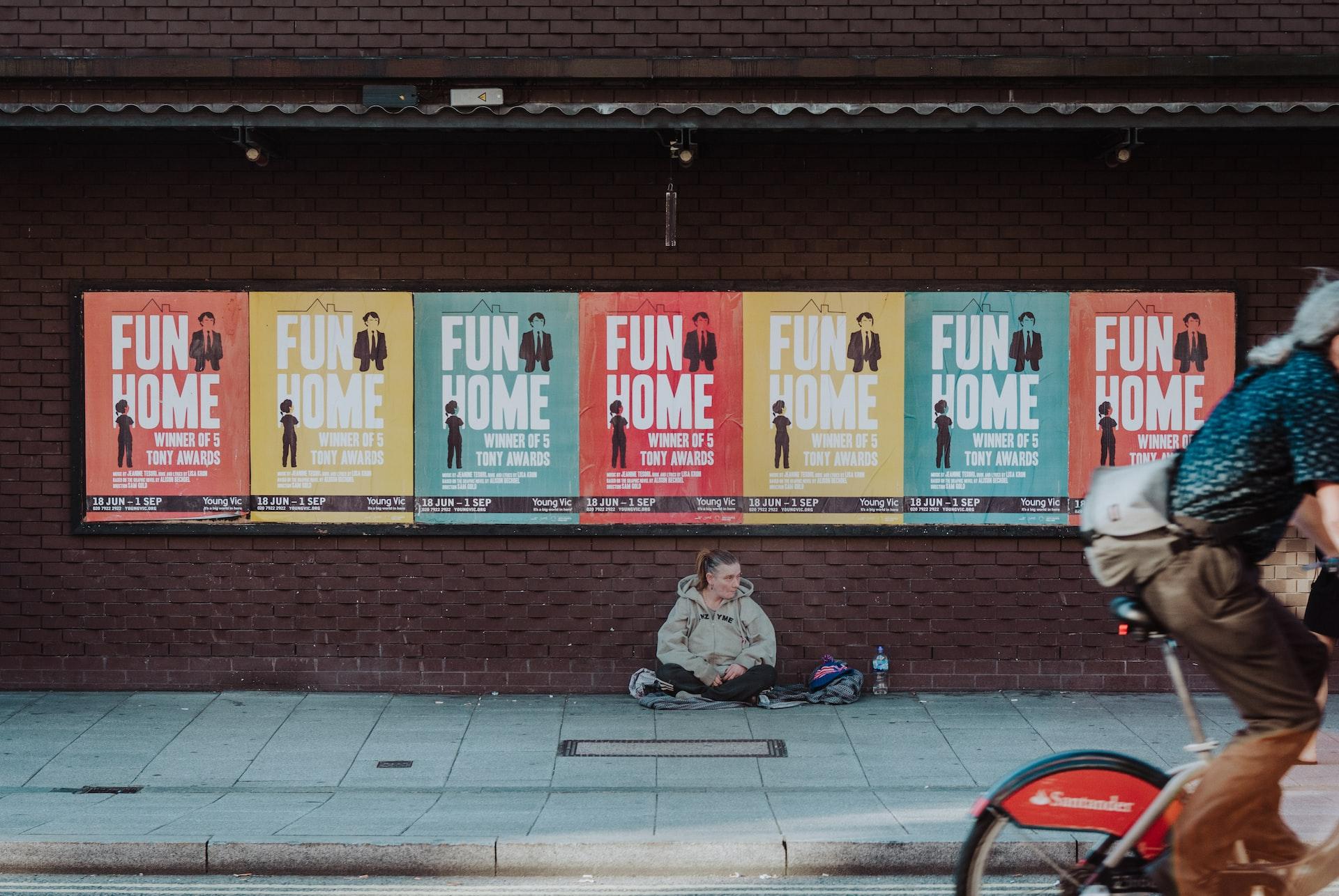person sitting on street